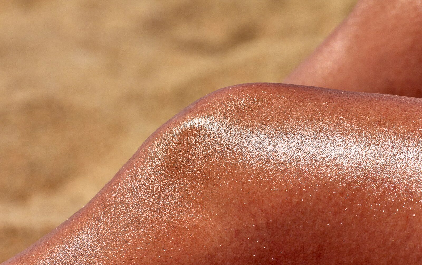 a close up of a person's tanning legs
